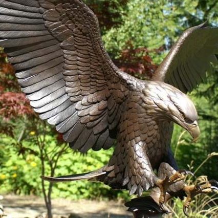 bronze statue of eagle with wings spread