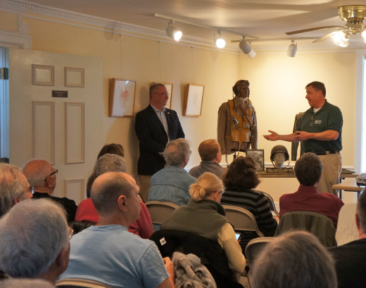 US Army officer Patrick J. Chaisson being introduced by Mark Tolf