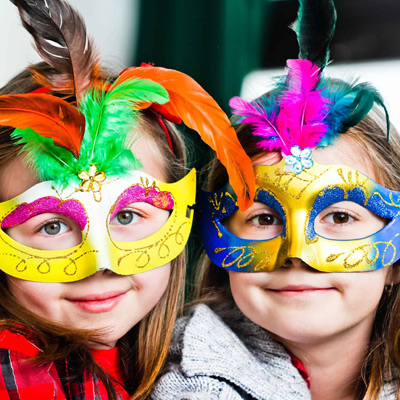 two girls in masks